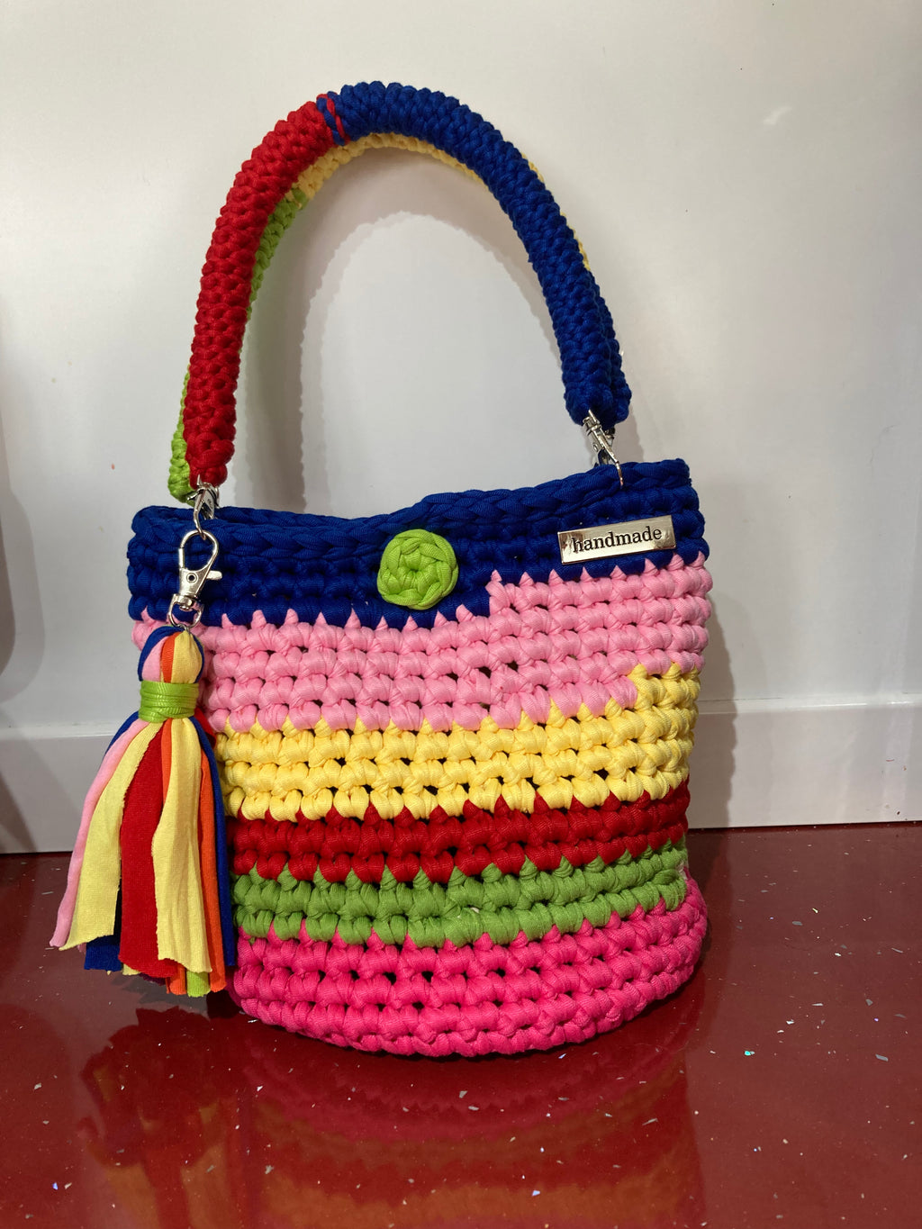 Multi coloured crocheted handbag