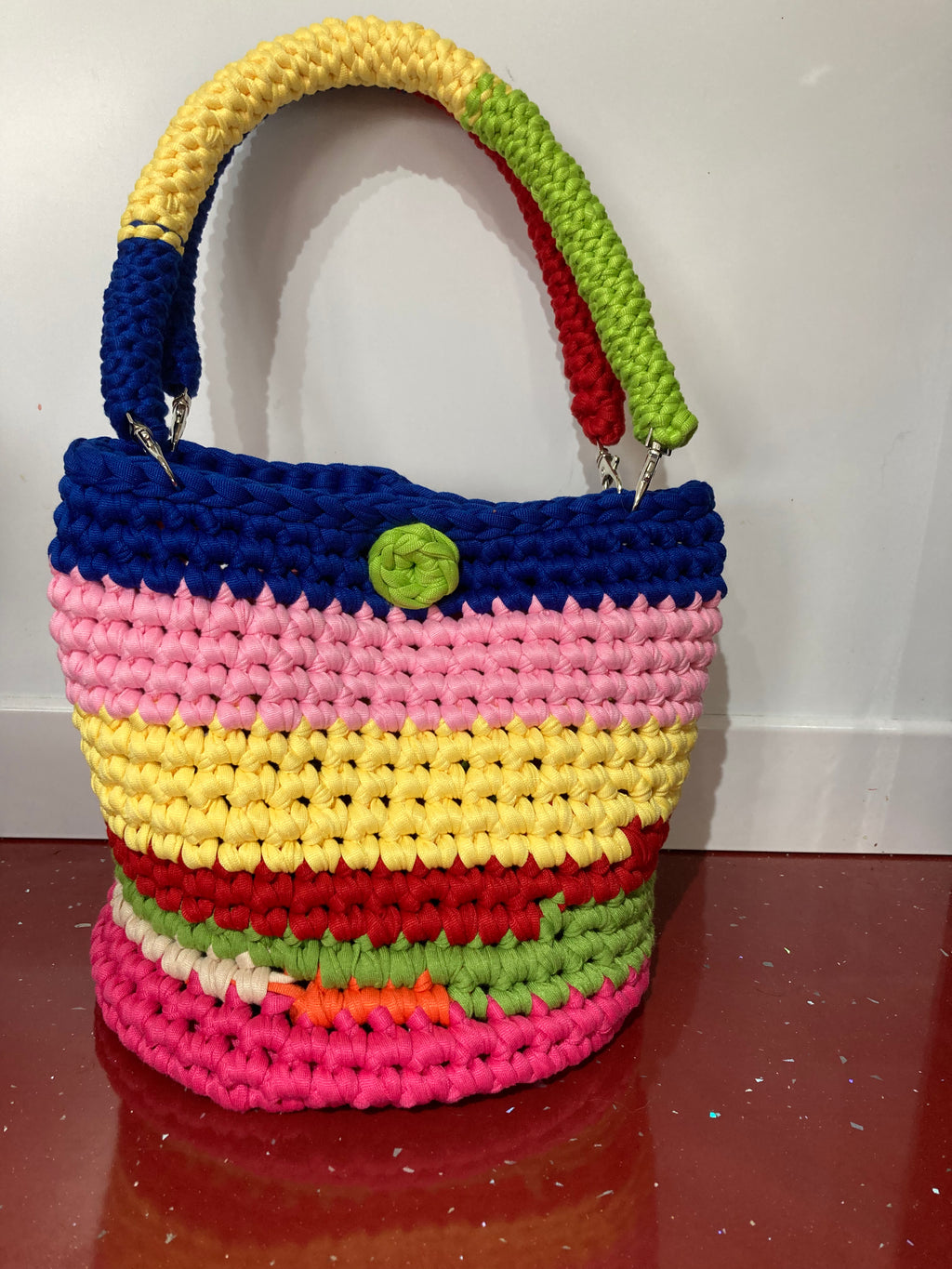 Multi coloured crocheted handbag