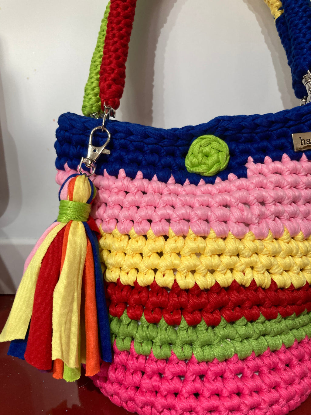 Multi coloured crocheted handbag