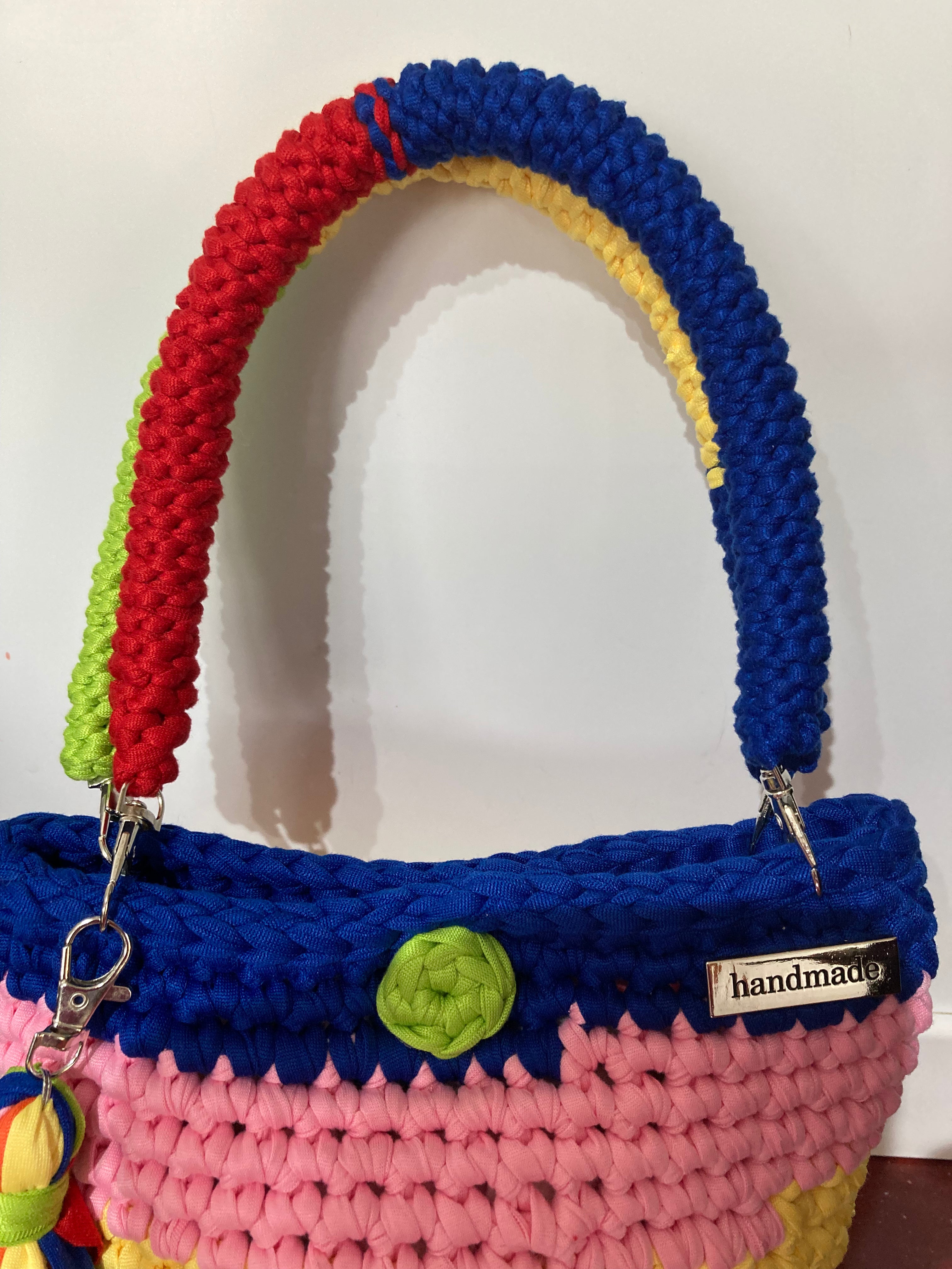 Multi coloured crocheted handbag